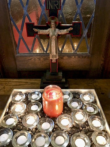 Prayer candles before a Sunday service